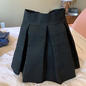 black pleated skirt